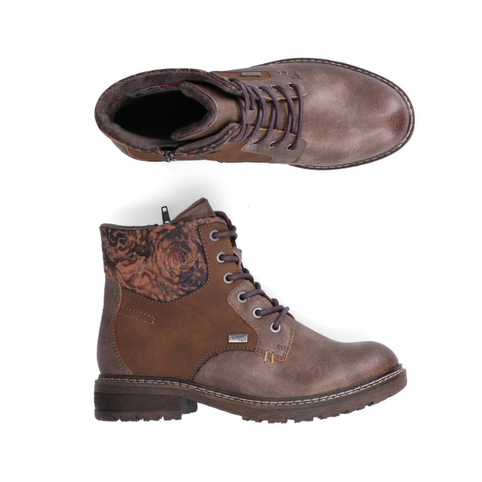 Pair of Brown lace up boots with distressed accents, floral cuff inside zipper and a low heel.