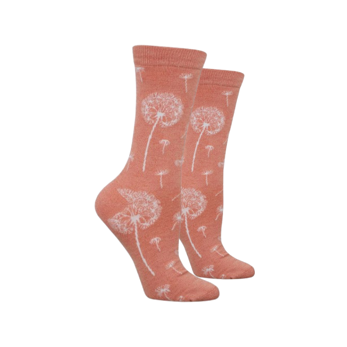 A pair of crew socks in a heathered peach-pink color with a white dandelion puff pattern.
