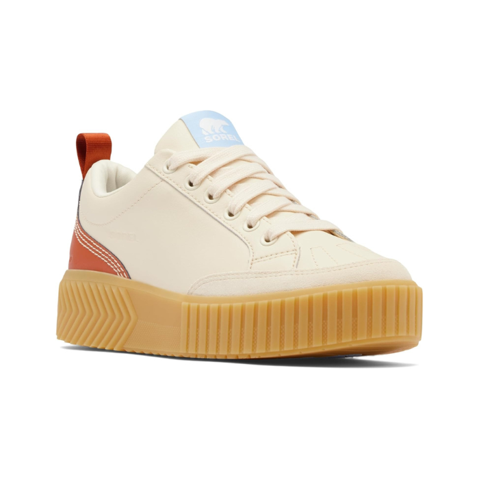Women's Sorel Out N About Sneaker in cream with gum sole and rust heel accent, waterproof leather lace-up design for casual wear.