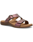 Purple metallic slide sandal with two Velcro straps, detail buckle, beige Taos logo'd footbed and black outsole.