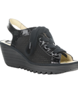 Black suede wedge sandal with thick laces, peep toe, patent accents and a lugged rubber outsole.