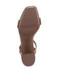 Brown light treaded outsole with Naturalizer logo in middle and a block heel.