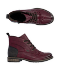 Pair of Maroon leather lace boots with brown laces, inside zipper, black heel cap and brown low outsole.