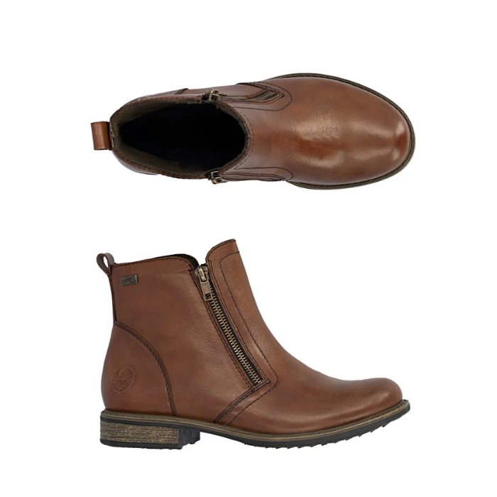 Pair of brown ankle boots with a side zippers, detailed stitching and a tan thin midsole and black outsole.