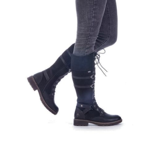 Model wearing black Tall Lace-Up Boots styled with jeans.