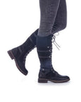 Model wearing black Tall Lace-Up Boots styled with jeans.