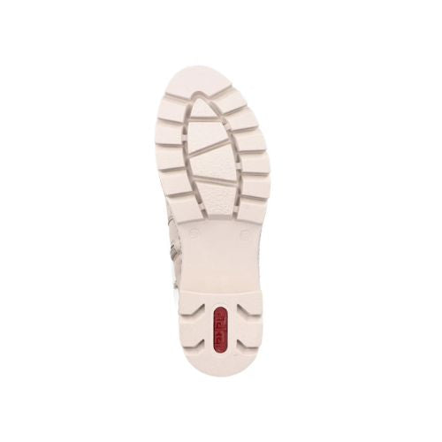 Treaded white outsole of Chelsea boot with red Rieker logo on heel.