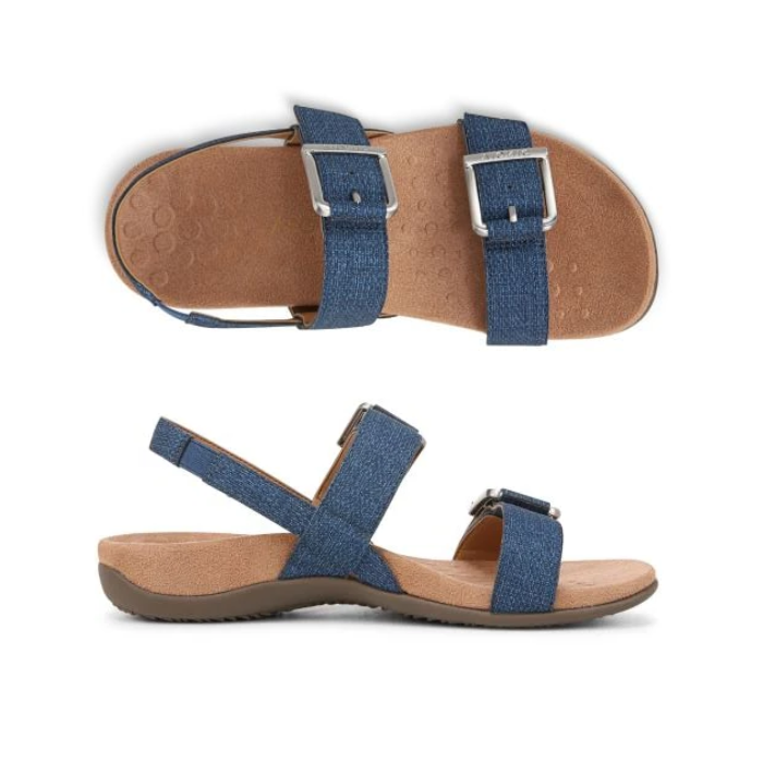 Pair of Blue jean backstrap sandals with two silver buckle straps, tan footbed and brown outsole.