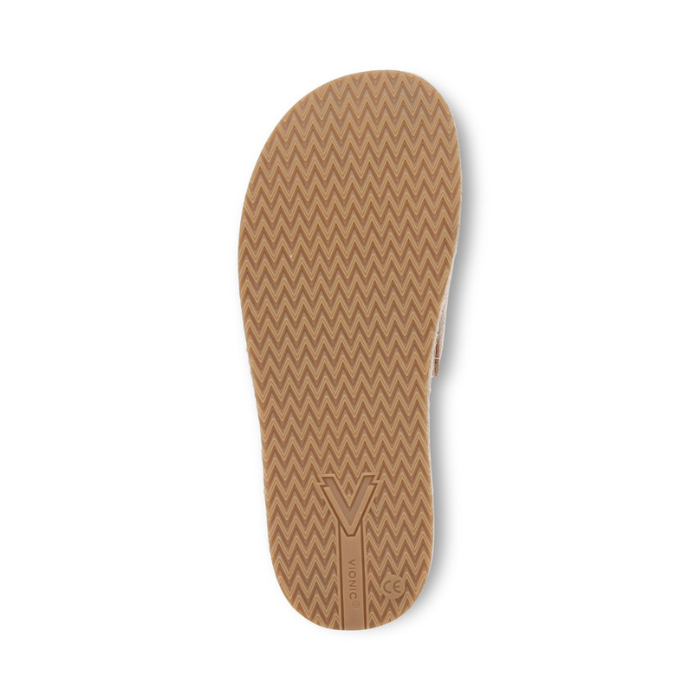 Tan outsole with a zigzag pattern.