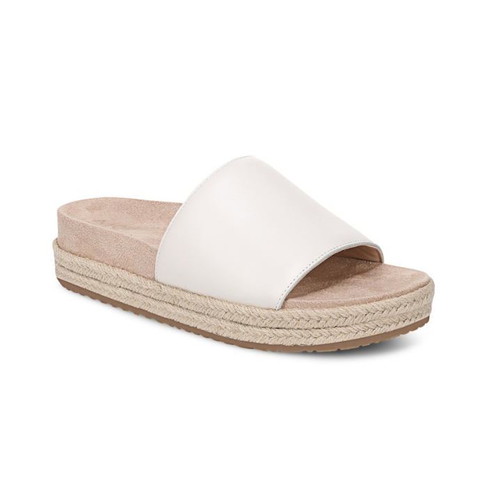 White slide espadrille sandal with tan footbed.