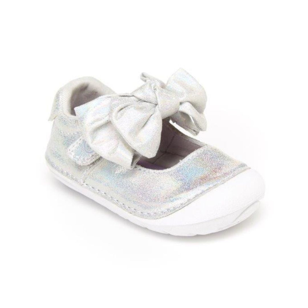 Silver mary-jane shoe with bow and white outsole.