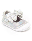 Silver mary-jane shoe with bow and white outsole.