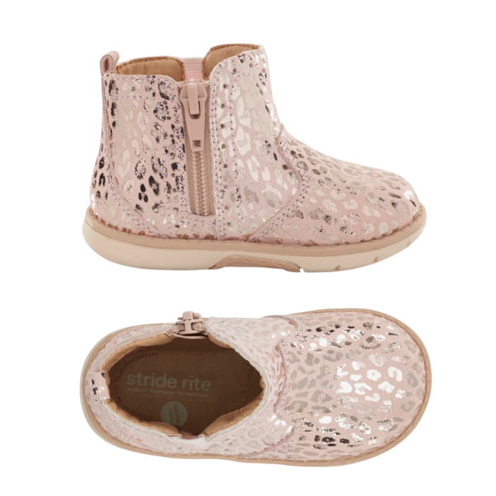 Pair of Pink kids ankle boot with rose gold leopard print pattern, elastic side goring, inside zipper and a tan soft bottom outsole.