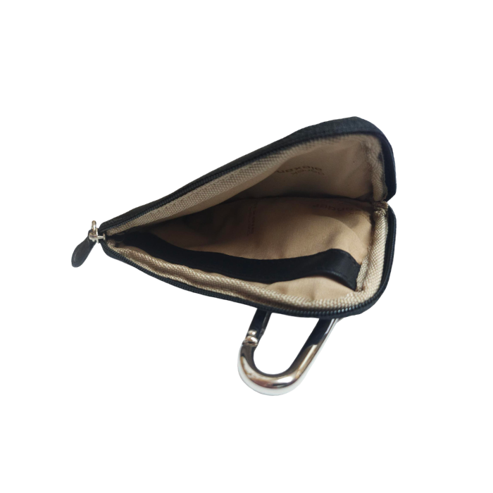Open black leather coin purse with tan fabric lining and silver carabiner.
