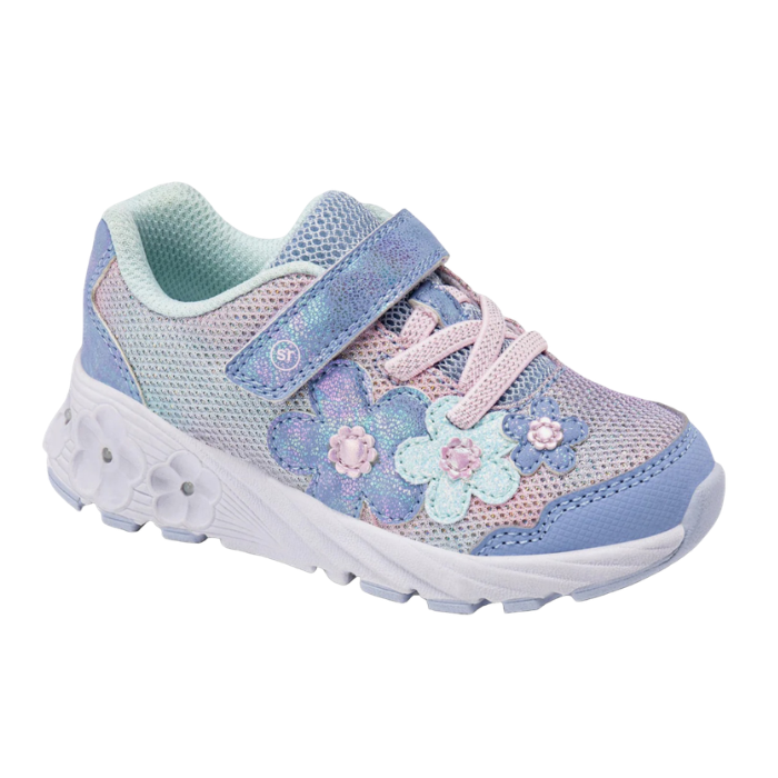 A children's sneaker in pastel blue, pink, and lavender with floral applique and a Velcro strap closure with a white outsole that has light up flowers.