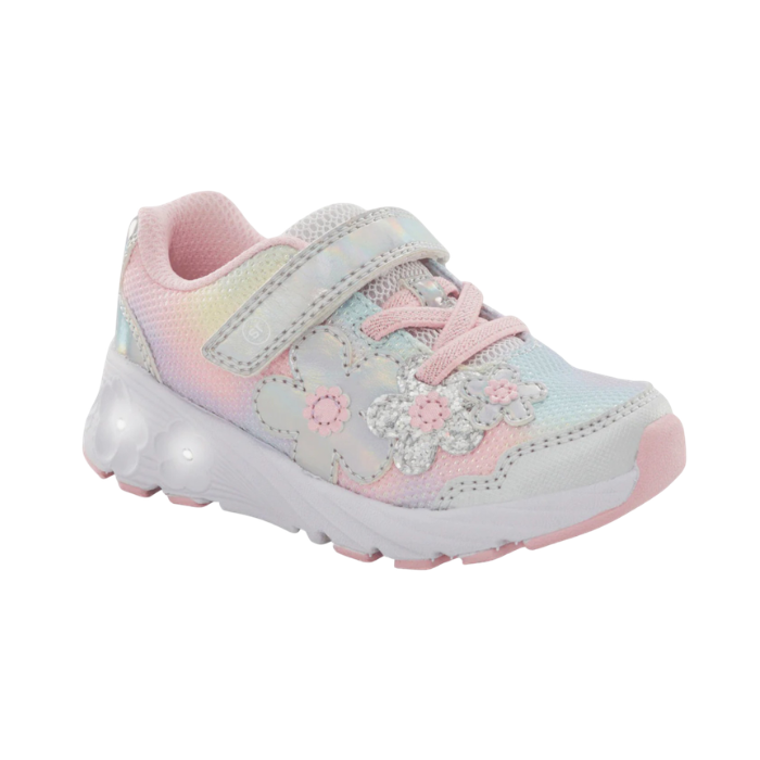 A children's sneaker in pastel pink, yellow, and blue with floral applique and a Velcro strap closure with a white outsole that has light up flowers.