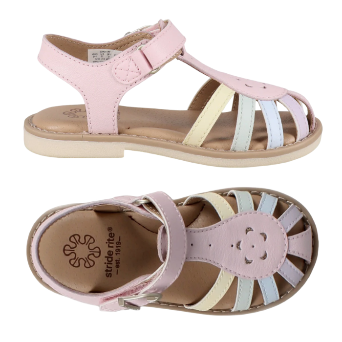 Pair of Pink sandals with caged toe box in pastel rainbow accent straps, tan footbed and beige outsole.