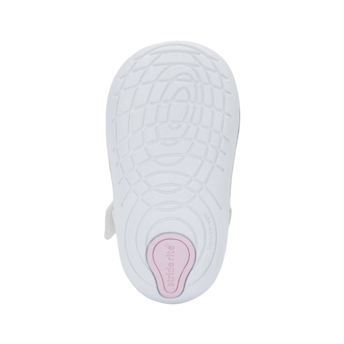 White light treaded outsole with Soft Motion sensory nodes and pink Stride Rite logo stamped on heel.