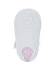 White light treaded outsole with Soft Motion sensory nodes and pink Stride Rite logo stamped on heel.