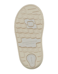 Beige outsole with sensory square design tread and Stride Rite logo stamped at the heel.