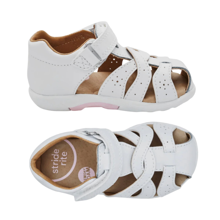 Pair of A toddler's white leather fisherman sandals with adjustable hook-and-loop strap, tan Stride Rite logo'd footbed and a contoured white outsole.
