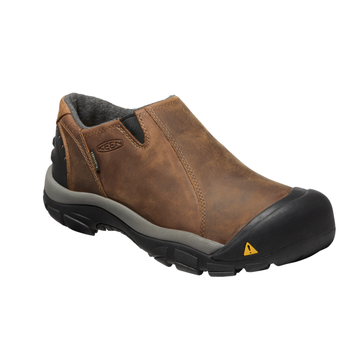 Brown leather slip-on shoe with black rubber heel and toe bumper connected to the black rubber outsole.