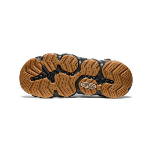 Brown textured outsole with Keen logo and black accents of fisherman sandal.