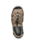 Top of Brown leather fisherman sandal with bungie laces and a black treaded rubber outsole with toe bumper.