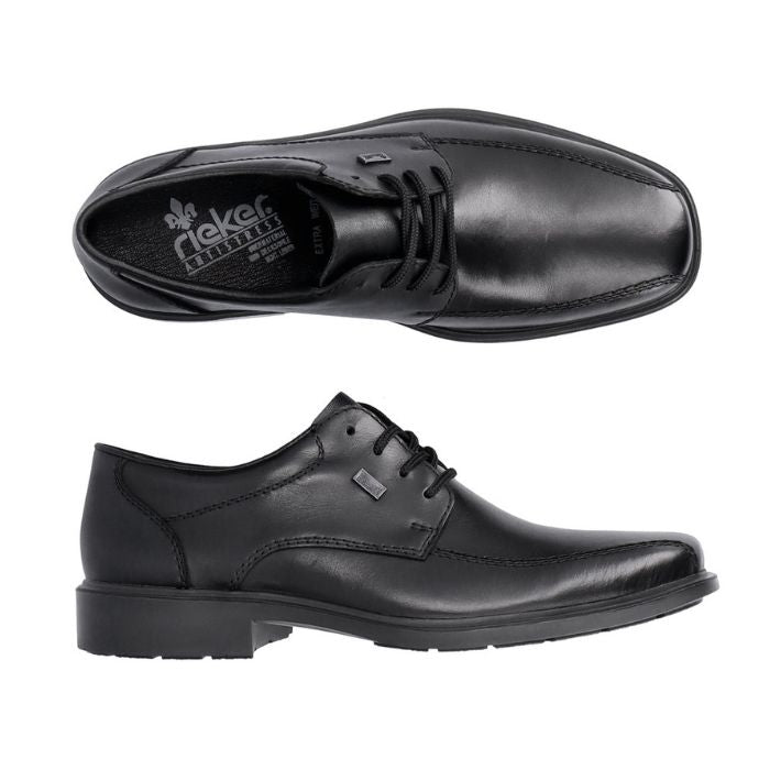 Top and side view of black leather dress shoe with bicycle toe. Grey Rieker logo on heel of black insole.