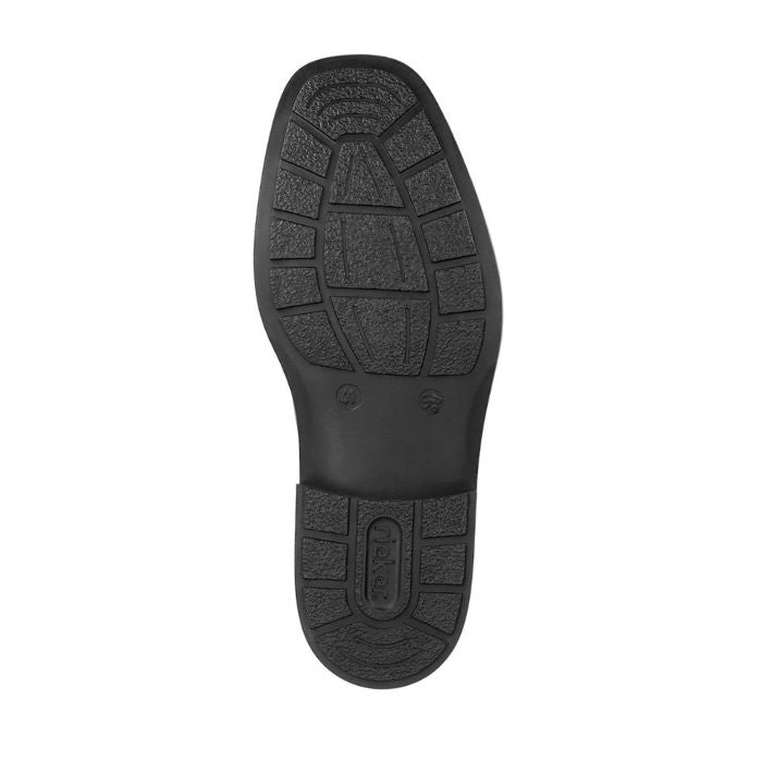 Black rubber outsole of men&#39;s dress shoe with Rieker logo on heel.