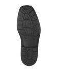 Black rubber outsole of men's dress shoe with Rieker logo on heel.