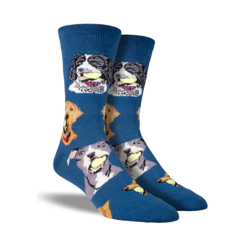 Blue socks with dog faces holding tennis balls in mouths.