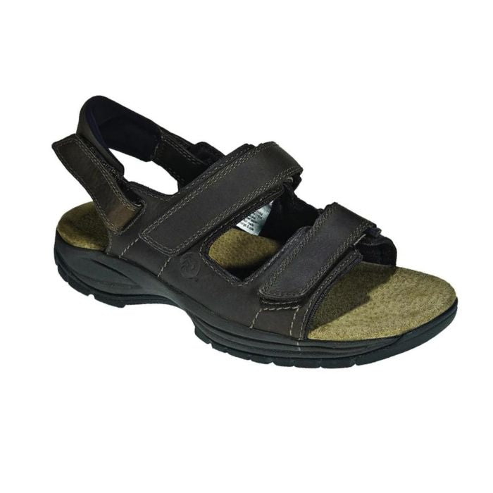 Brown sandal with adjustable Velcro straps and removable backstrap. Dunham logo imprinted on side.