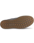 Tan outsole with circle tread pattern and Ecco logo on heel.