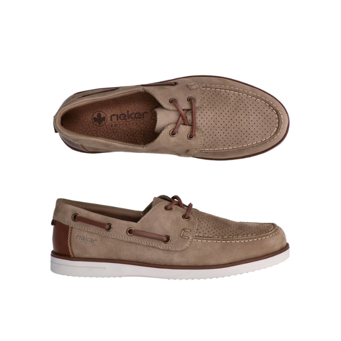 Pair of beige boat shoes with brown lacing, accent stitching, tan Rieker logo'd footbed and white outsole.