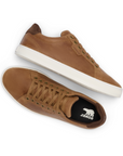 Pair of Brown leather casual sneakers with black Sorel logo'd footbed and white outsole.