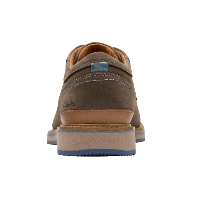 Heel of Brown nubuck dress shoe with  accent stitching, Clarks logo stamped on edge and brown midsole.