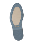 Blue outsole with white tread centrer and Clarks logo in middle.