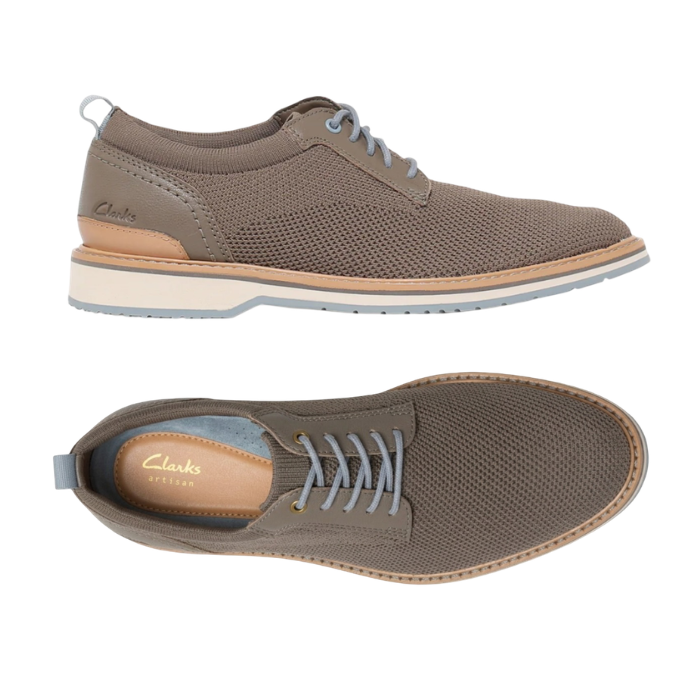 Pair of Soft grey semi-dress knita shoe with blue accent laces, blue heel cap, tan and blue suede Clark's logo'd footbed, white midsole and blue outsole.