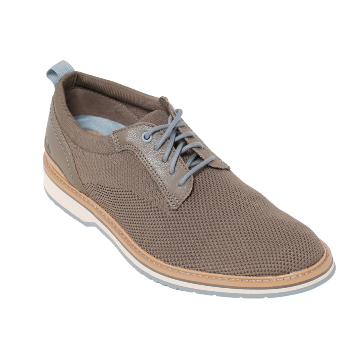 Soft grey semi-dress knit shoe with blue accent laces, blue heel cap, white midsole and blue outsole.