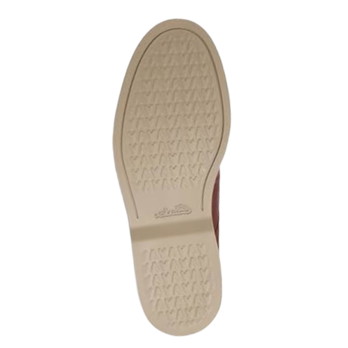 Beige light treaded dress shoe outsole with Clarks logo stamped in middle.