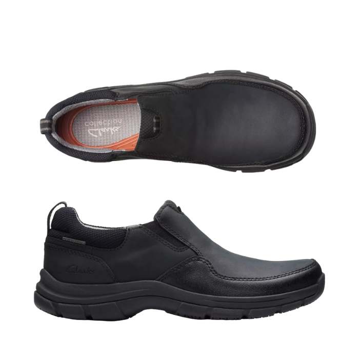 Pair of Black slip-on shoe with Clark's logo'd grey footbed and a thick outsole.