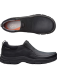 Pair of Black slip-on shoe with Clark's logo'd grey footbed and a thick outsole.