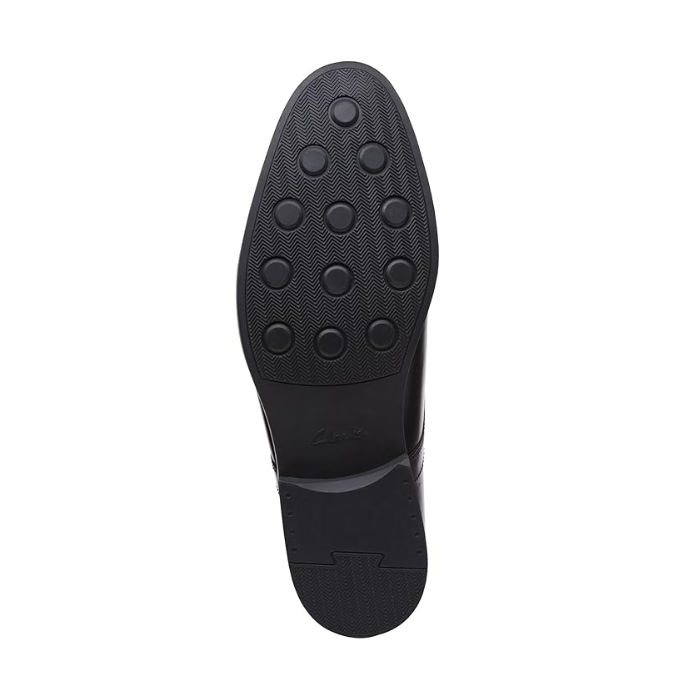 Black rubber outsole with circle tread pattern.