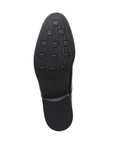 Black rubber outsole with circle tread pattern.