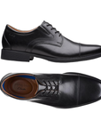 Pair of Black leather derby dress shoes with stitching details, tan Clark's logo'd footbed and low heel. 