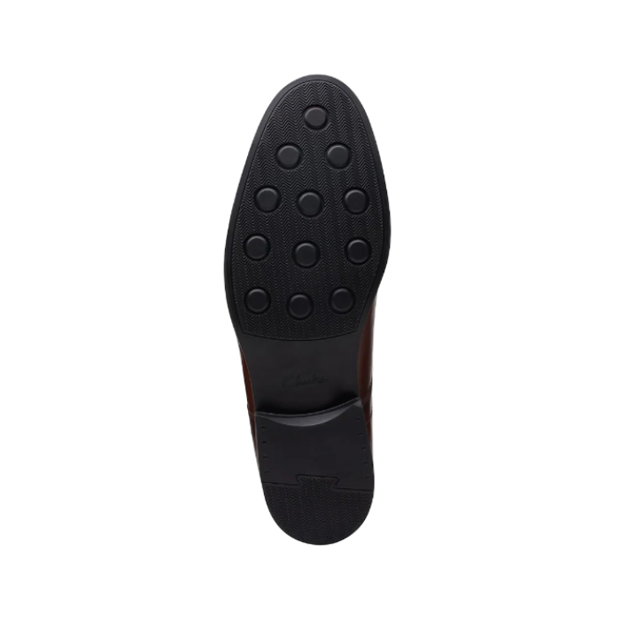 Black rubber outsole with circle tread pattern.