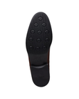 Black rubber outsole with circle tread pattern.