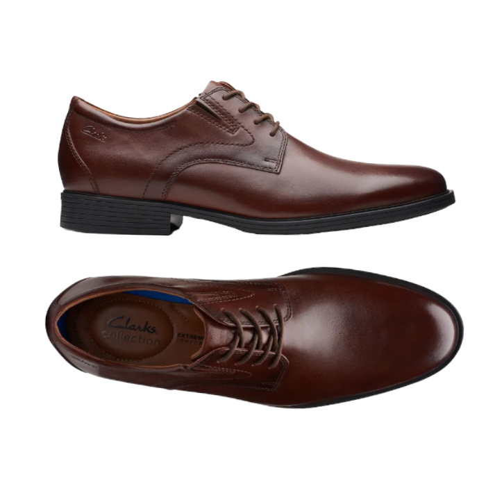 Pair of Brown Mahogany leather derby dress shoes with stitching details, tan Clark's logo'd footbed and low heel. 