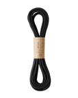 Black flat laces in a brown paper wrap.